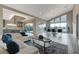 Expansive open-concept living area featuring sleek hardwood floors, modern furnishings, and abundant natural light at 6832 Apogee Ridge Ct, Las Vegas, NV 89135