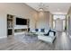 Bright living room with vaulted ceilings, recessed lighting, fireplace and large windows at 6832 Apogee Ridge Ct, Las Vegas, NV 89135