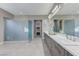 Modern main bathroom featuring a glass enclosed shower, double sinks, and generous counter space at 6832 Apogee Ridge Ct, Las Vegas, NV 89135