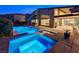 Inviting backyard pool and spa with stone accents and lush landscaping offer a perfect outdoor retreat at 6832 Apogee Ridge Ct, Las Vegas, NV 89135