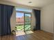 Bedroom with direct access to the backyard oasis with artificial grass and landscaping at 6837 Crimson Lily St, Las Vegas, NV 89139