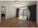 Bright bedroom featuring sliding glass door to a backyard, connecting indoor and outdoor living at 6837 Crimson Lily St, Las Vegas, NV 89139