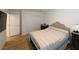 Comfortable bedroom with wood floors, neutral walls, and a cozy bed, offering a serene atmosphere at 6837 Crimson Lily St, Las Vegas, NV 89139