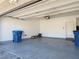 Spacious three-car garage with epoxy floors, lighting, and storage areas at 6837 Crimson Lily St, Las Vegas, NV 89139