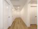 Hallway features modern lighting, clean lines, and multiple doors, creating a sense of spaciousness at 6837 Crimson Lily St, Las Vegas, NV 89139