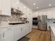 Well-equipped kitchen with stainless steel appliances, ample cabinet space, and modern backsplash at 6837 Crimson Lily St, Las Vegas, NV 89139