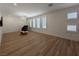 Spacious living room featuring wood floors, recessed lighting and multiple windows, creating a welcoming space at 6837 Crimson Lily St, Las Vegas, NV 89139