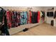 Well-organized walk-in closet with a variety of hanging clothes and shoe storage at 6837 Crimson Lily St, Las Vegas, NV 89139