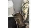 Toilet with dirty flooring and shower curtain at 693 W Pacific Ave, Henderson, NV 89002