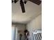 Bedroom ceiling with fan and view of the walls with peeling paint at 693 W Pacific Ave, Henderson, NV 89002