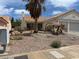 Single-story stucco home featuring desert landscaping and two-car garage at 693 W Pacific Ave, Henderson, NV 89002