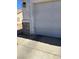 Close-up of a two-car garage door with peeling stucco at 693 W Pacific Ave, Henderson, NV 89002