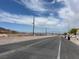 Street with desert landscaping and a view of the mountains in the distance at 693 W Pacific Ave, Henderson, NV 89002