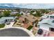 An aerial view of a home with well-kept lawn and driveway, set against a suburban landscape at 7604 Charles Conrad Cir, Las Vegas, NV 89145
