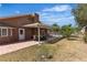 Inviting backyard featuring a covered patio, lush lawn, and sparkling pool for outdoor enjoyment at 7604 Charles Conrad Cir, Las Vegas, NV 89145