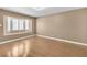 Spacious bedroom with hardwood floors and a charming bay window, creating a bright and inviting atmosphere at 7604 Charles Conrad Cir, Las Vegas, NV 89145