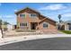 Charming two-story home featuring a well-maintained front yard and welcoming entrance at 7604 Charles Conrad Cir, Las Vegas, NV 89145
