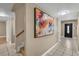 Hallway featuring neutral walls, tile flooring, and access to other rooms at 7604 Charles Conrad Cir, Las Vegas, NV 89145