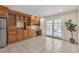 Kitchen area with custom cabinetry, granite countertops and French doors leading to patio at 7604 Charles Conrad Cir, Las Vegas, NV 89145