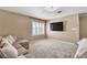 Inviting living room with large window, a TV, and a comfortable couch, perfect for relaxation and entertainment at 7604 Charles Conrad Cir, Las Vegas, NV 89145