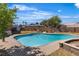 Backyard view featuring an in-ground pool with a patio, offering a refreshing retreat on sunny days at 7604 Charles Conrad Cir, Las Vegas, NV 89145