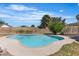 A refreshing in-ground pool surrounded by lush landscaping and a well-manicured lawn at 7604 Charles Conrad Cir, Las Vegas, NV 89145