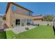 The backyard has a firepit, patio furniture, and turf at 8022 Severn Valley St, Las Vegas, NV 89139