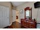 This bedroom features wood floors and dark wood furniture at 8022 Severn Valley St, Las Vegas, NV 89139