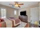 Comfortable bedroom with modern dresser, ceiling fan, and bright window with shutter, creating a cozy retreat at 8022 Severn Valley St, Las Vegas, NV 89139
