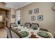 Cozy dining room with seating for six, neutral walls and decor at 8022 Severn Valley St, Las Vegas, NV 89139