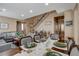 Open-concept layout of dining room with access to the living room and featuring a staircase at 8022 Severn Valley St, Las Vegas, NV 89139