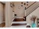 Inviting entryway featuring a staircase with wood treads and white risers, plus neutral-toned walls and decor at 8022 Severn Valley St, Las Vegas, NV 89139