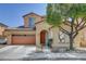 Charming two-story home featuring a two-car garage, desert landscaping, and an inviting arched entryway at 8022 Severn Valley St, Las Vegas, NV 89139