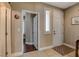 Hallway featuring tile floors, a large closet, and a view of an adjacent bedroom or office at 8022 Severn Valley St, Las Vegas, NV 89139