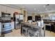 Bright kitchen open to living space, stainless appliances and bar seating at 8022 Severn Valley St, Las Vegas, NV 89139