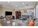 Spacious living room featuring hardwood floors, plush seating, and natural light at 8022 Severn Valley St, Las Vegas, NV 89139