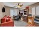 Dedicated office space with built-in bookshelves, comfortable seating, and bright window that creates an ideal workspace at 8022 Severn Valley St, Las Vegas, NV 89139