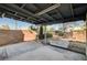 Covered patio with a brick wall and gravel landscaping in the backyard at 804 S Mallard St, Las Vegas, NV 89107