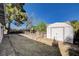 Backyard with metal shed, gravel landscaping and perimeter fence at 804 S Mallard St, Las Vegas, NV 89107