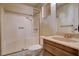 Bathroom featuring a sink vanity with a large mirror and a combination shower and bathtub at 804 S Mallard St, Las Vegas, NV 89107