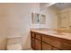 Bathroom featuring a vanity with decorative woodgrain cabinets and a neutral countertop at 804 S Mallard St, Las Vegas, NV 89107