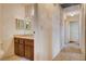 Hallway and partial bathroom view with tile flooring and classic vanity at 804 S Mallard St, Las Vegas, NV 89107