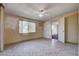 Inviting bedroom with tiled floors, neutral walls, and natural light, offering a cozy retreat at 804 S Mallard St, Las Vegas, NV 89107