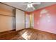 A bedroom featuring a ceiling fan and closet space, offering practical storage solutions at 804 S Mallard St, Las Vegas, NV 89107