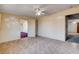 Comfortable bedroom with tiled floors, neutral walls, and convenient access to adjacent rooms, ideal for relaxation at 804 S Mallard St, Las Vegas, NV 89107