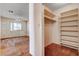 Bedroom with attached closet featuring built-in shelving at 804 S Mallard St, Las Vegas, NV 89107