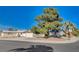 Street view of home on a corner lot with mature landscaping and ample parking at 804 S Mallard St, Las Vegas, NV 89107