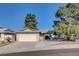Charming single-story home with a large driveway and mature trees enhancing its curb appeal at 804 S Mallard St, Las Vegas, NV 89107