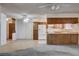 Open layout from kitchen into a spacious living room with tile flooring and white appliances at 804 S Mallard St, Las Vegas, NV 89107