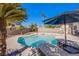 Inviting backyard with a swimming pool, spa, and lounge area, perfect for relaxation at 8321 Gorsky Ave, Las Vegas, NV 89131